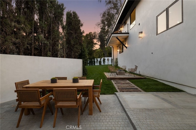 721 Wilson Ct, Burbank, CA 91501 - patio terrace at dusk with a balcony, a patio area, and outdoor dining area