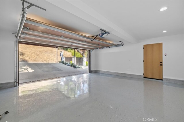 721 Wilson Ct, Burbank, CA 91501 - garage featuring a garage door opener, baseboards, and recessed lighting