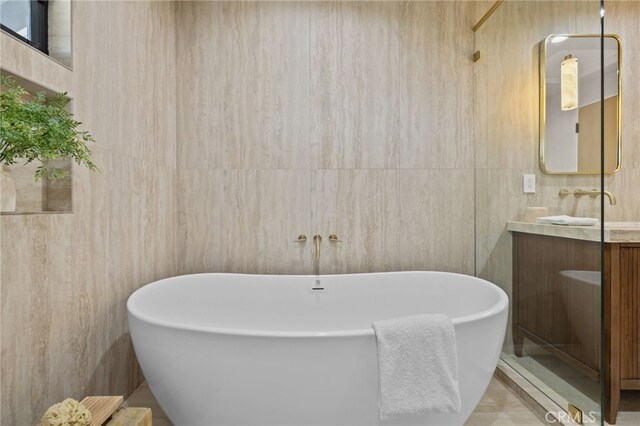 721 Wilson Ct, Burbank, CA 91501 - full bathroom with a freestanding tub, vanity, and tile walls