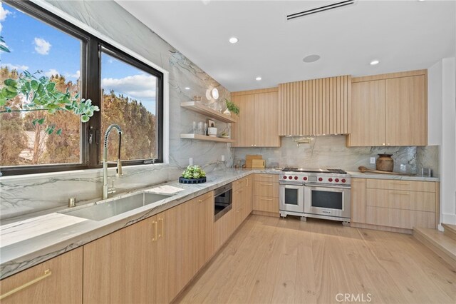 721 Wilson Ct, Burbank, CA 91501 - kitchen featuring double oven range, light brown cabinetry, modern cabinets, a sink, and recessed lighting