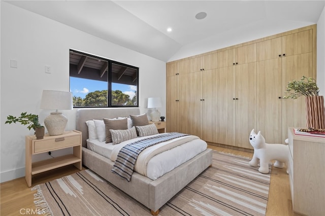 721 Wilson Ct, Burbank, CA 91501 - bedroom with lofted ceiling and light wood-style flooring