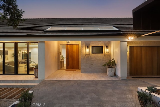 721 Wilson Ct, Burbank, CA 91501 - back of house at dusk with solar panels and a tile roof