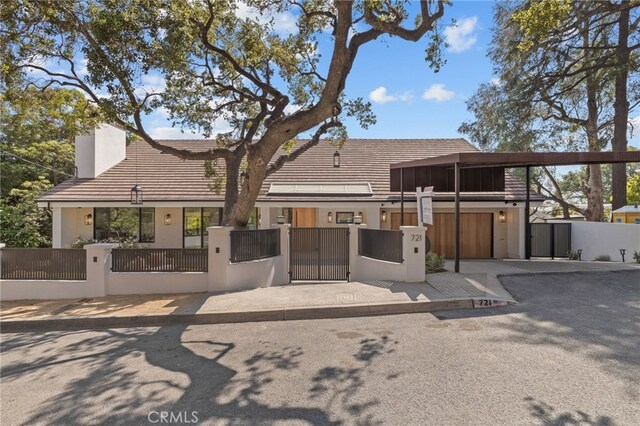 721 Wilson Ct, Burbank, CA 91501 - view of front facade with a fenced front yard, a chimney, a gate, and a tile roof