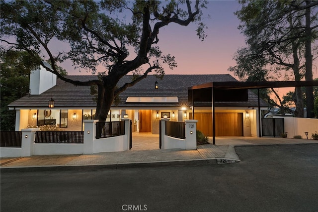 721 Wilson Ct, Burbank, CA 91501 - view of front facade with a fenced front yard, driveway, solar panels, a gate, and a chimney