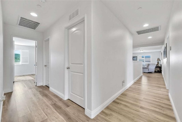 34253 Mazarine Dr, Temecula, CA 92592 - hall with light wood-style flooring, baseboards, and recessed lighting