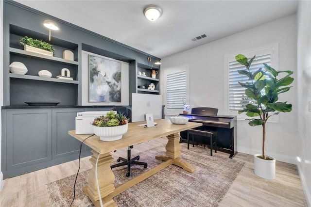 34253 Mazarine Dr, Temecula, CA 92592 - office area featuring light wood-style flooring, baseboards, and built in shelves