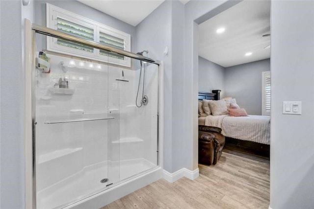 34253 Mazarine Dr, Temecula, CA 92592 - ensuite bathroom featuring wood finished floors, a stall shower, and baseboards