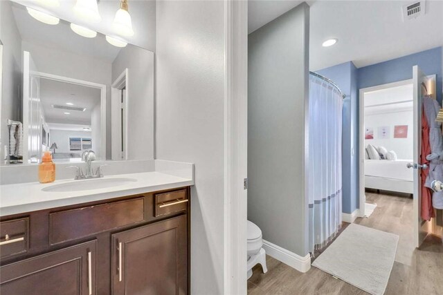 34253 Mazarine Dr, Temecula, CA 92592 - full bath with vanity, wood finished floors, connected bathroom, and toilet