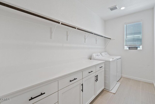 17065 Laurel Rd, Morgan Hill, CA 95037 - laundry area with washing machine and clothes dryer, cabinet space, and recessed lighting