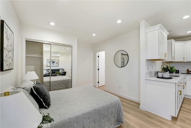 2380 Westcott Ave, Monterey Park, CA 91754 - bedroom featuring light wood finished floors, a sink, recessed lighting, baseboards, and a closet