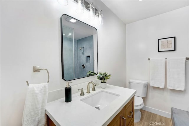 2380 Westcott Ave, Monterey Park, CA 91754 - full bathroom with vanity, toilet, wood finished floors, and baseboards