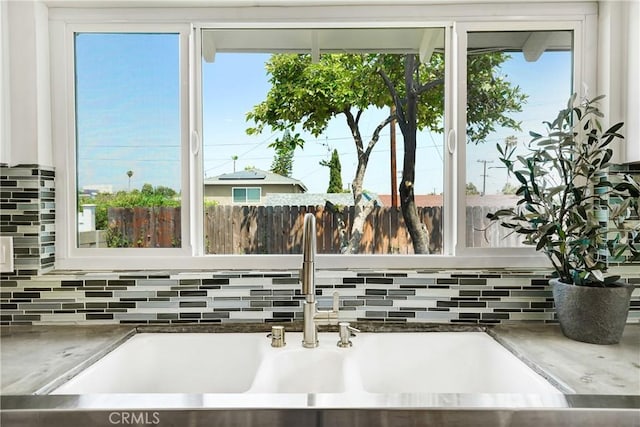 2380 Westcott Ave, Monterey Park, CA 91754 - kitchen view of a sink, tasteful backsplash, and white cabinets