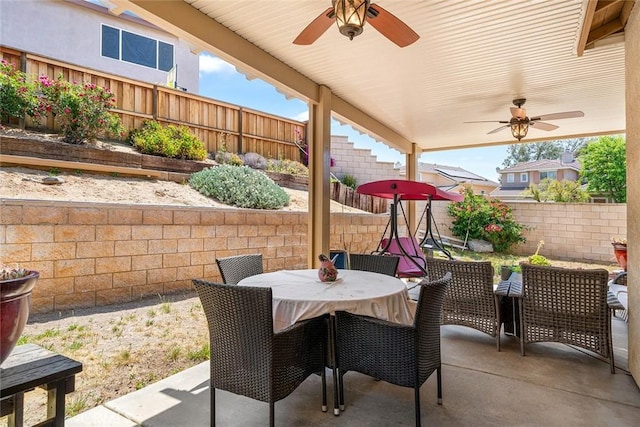 31332 Gatehouse Ct, Murrieta, CA 92563 - fenced backyard with a ceiling fan, a patio, and outdoor dining space
