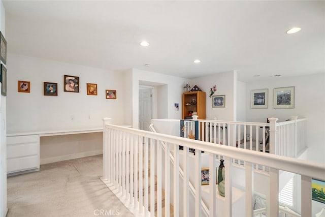 31332 Gatehouse Ct, Murrieta, CA 92563 - corridor featuring an upstairs landing, a desk, light carpet, and recessed lighting