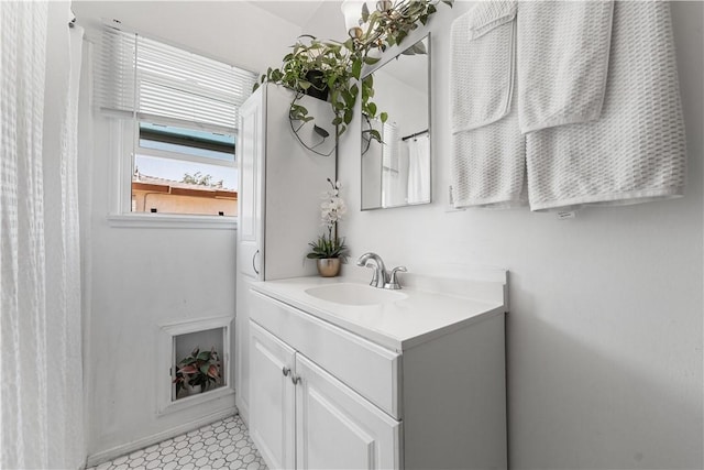 44246 Foxton Ave, Lancaster, CA 93535 - bathroom with vanity, baseboards, and tile patterned floors