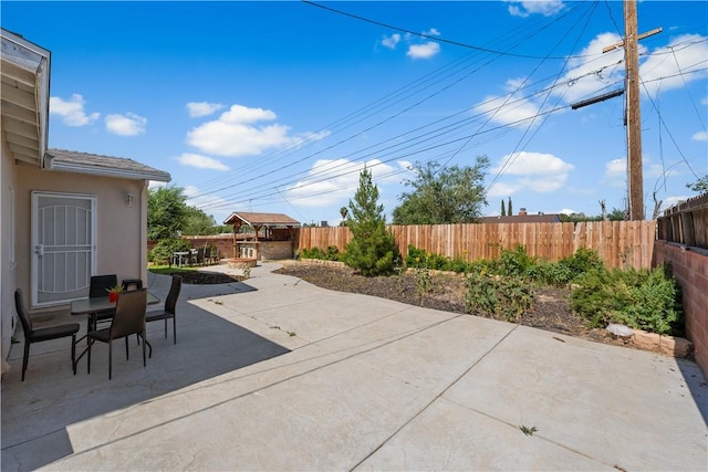 44246 Foxton Ave, Lancaster, CA 93535 - fenced backyard featuring a patio area and outdoor dining space