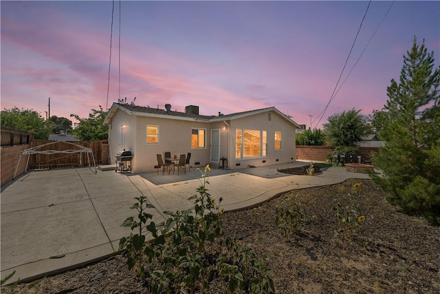 44246 Foxton Ave, Lancaster, CA 93535 - back of property featuring a patio area, stucco siding, and a fenced backyard