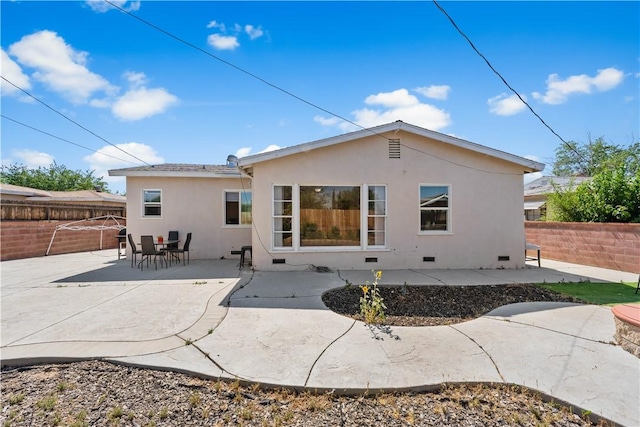 44246 Foxton Ave, Lancaster, CA 93535 - rear view of property featuring stucco siding, a fenced backyard, a patio, and crawl space
