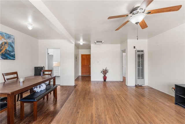 44246 Foxton Ave, Lancaster, CA 93535 - dining room with a heating unit, ceiling fan, and wood finished floors