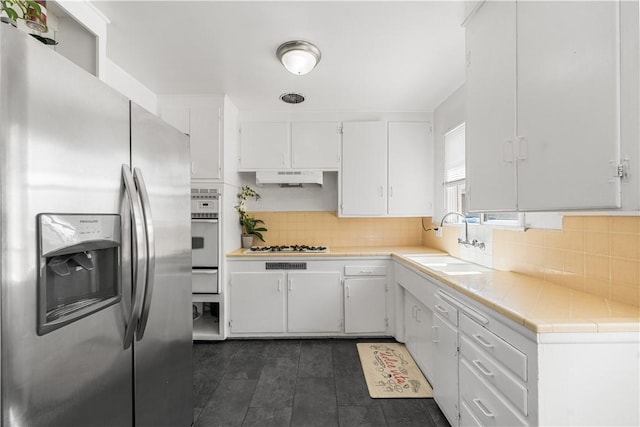 44246 Foxton Ave, Lancaster, CA 93535 - kitchen featuring white appliances, a sink, white cabinets, a warming drawer, and under cabinet range hood