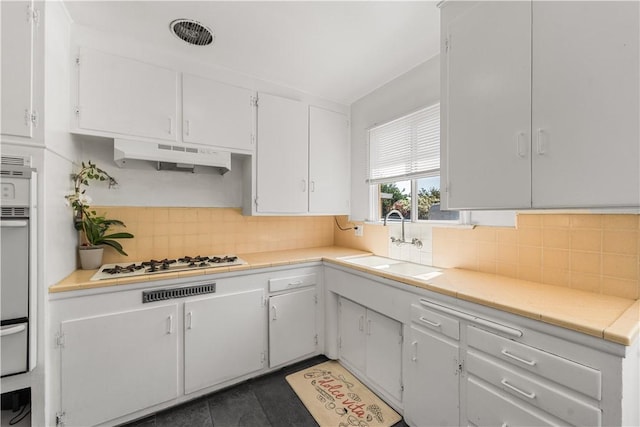 44246 Foxton Ave, Lancaster, CA 93535 - kitchen featuring a sink, under cabinet range hood, white cabinetry, and white gas stovetop