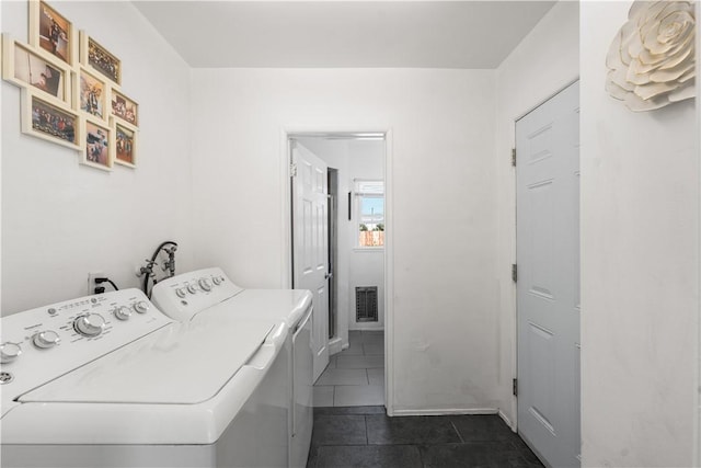 44246 Foxton Ave, Lancaster, CA 93535 - laundry room with separate washer and dryer and dark tile patterned flooring