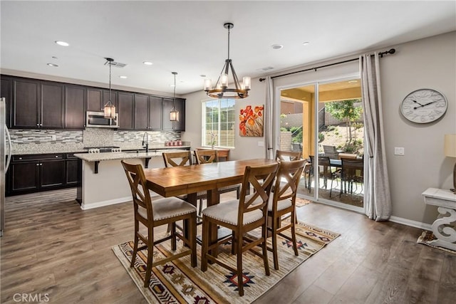 37436 Umbrella, Palmdale, CA 93551 - dining area featuring healthy amount of natural light, dark wood finished floors, a chandelier, and recessed lighting