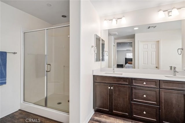 37436 Umbrella, Palmdale, CA 93551 - ensuite bathroom featuring a stall shower, wood finished floors, double vanity, and baseboards