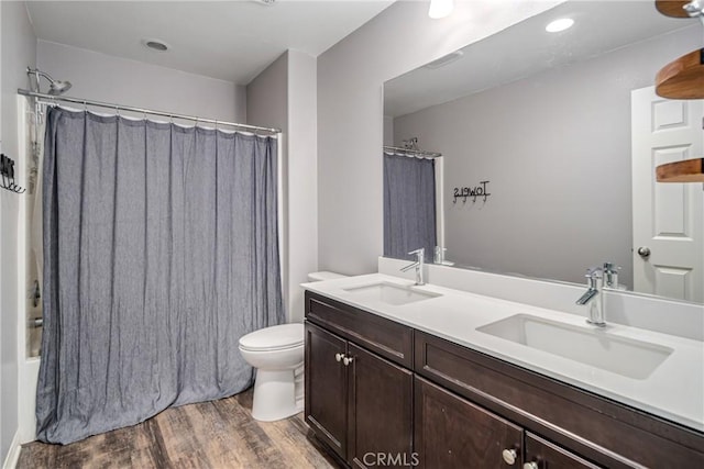 37436 Umbrella, Palmdale, CA 93551 - full bath featuring wood finished floors, double vanity, toilet, and shower / bath combo with shower curtain