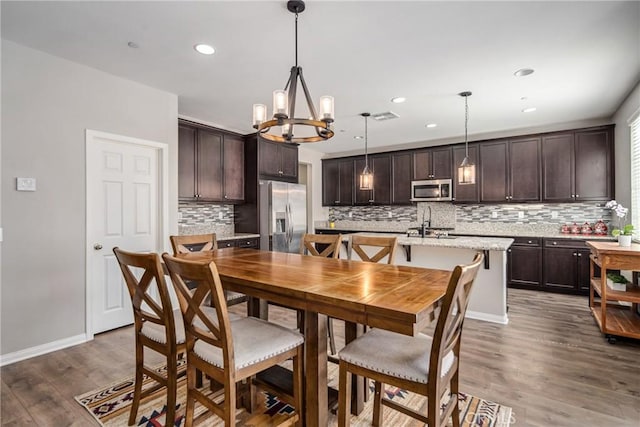 37436 Umbrella, Palmdale, CA 93551 - dining room featuring a chandelier, dark wood-type flooring, recessed lighting, and baseboards