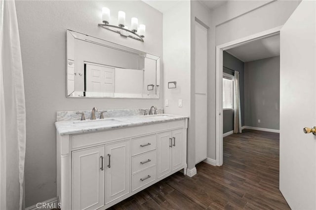 5191 Westerfield St, Jurupa Valley, CA 92509 - full bathroom featuring double vanity and wood finished floors