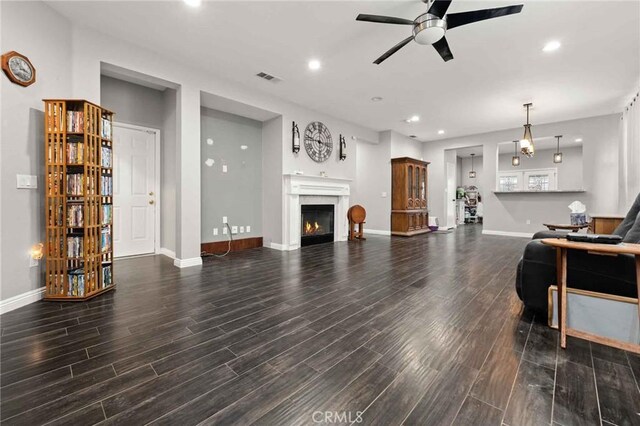 5191 Westerfield St, Jurupa Valley, CA 92509 - living room featuring ceiling fan, wood finished floors, recessed lighting, and a lit fireplace