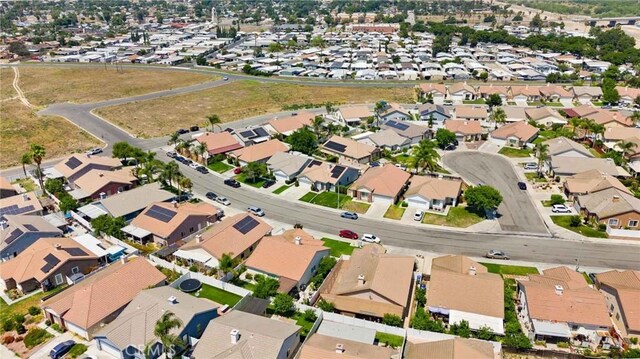 5191 Westerfield St, Jurupa Valley, CA 92509 - aerial overview of property's location with nearby suburban area