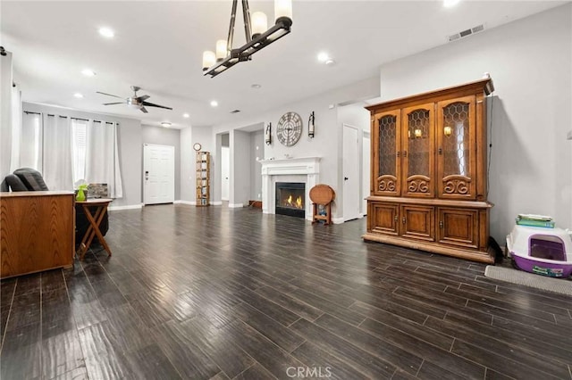 5191 Westerfield St, Jurupa Valley, CA 92509 - living room featuring a ceiling fan, recessed lighting, a glass covered fireplace, and wood finished floors