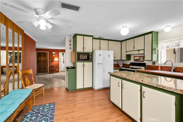 7608 Shawnee Trl, Yucca Valley, CA 92284 - kitchen featuring white appliances, a sink, green cabinets, light wood-type flooring, and under cabinet range hood