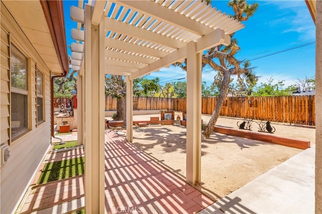 7608 Shawnee Trl, Yucca Valley, CA 92284 - fenced backyard with an outdoor hangout area, a pergola, and a patio area