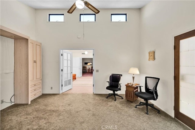 7608 Shawnee Trl, Yucca Valley, CA 92284 - living area featuring a towering ceiling, ceiling fan, carpet flooring, and french doors