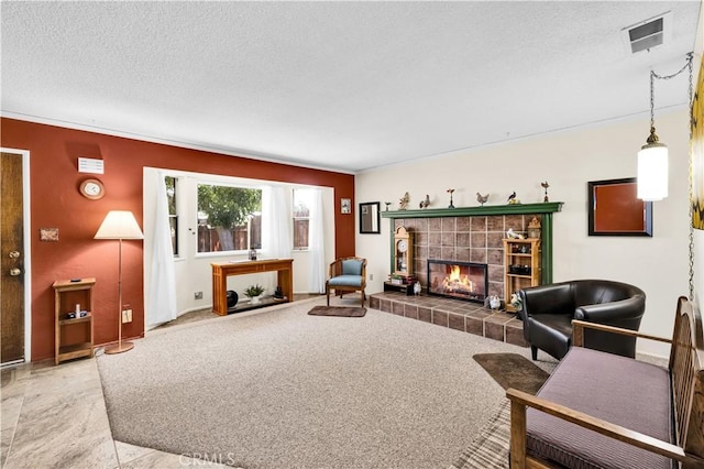 7608 Shawnee Trl, Yucca Valley, CA 92284 - living room featuring a tile fireplace, a textured ceiling, and crown molding