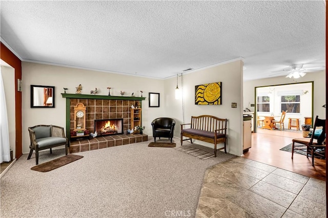7608 Shawnee Trl, Yucca Valley, CA 92284 - living room with a textured ceiling, ornamental molding, a fireplace, and a ceiling fan