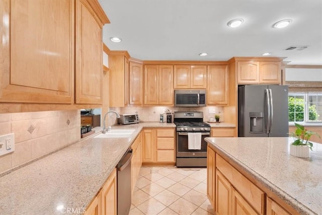 1626 S Boulder Ave, Ontario, CA 91762 - kitchen featuring stainless steel appliances, light brown cabinets, a sink, light stone countertops, and recessed lighting