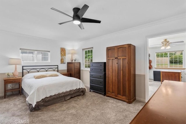 1626 S Boulder Ave, Ontario, CA 91762 - bedroom featuring a wainscoted wall, multiple windows, crown molding, light carpet, and ceiling fan