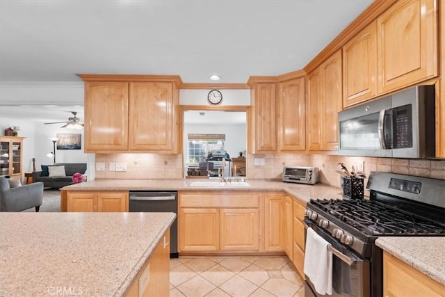 1626 S Boulder Ave, Ontario, CA 91762 - kitchen featuring stainless steel appliances, light brown cabinetry, a sink, decorative backsplash, and ornamental molding