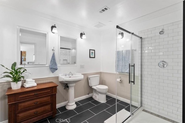 1626 S Boulder Ave, Ontario, CA 91762 - bathroom with toilet, a shower stall, wainscoting, and tile patterned floors