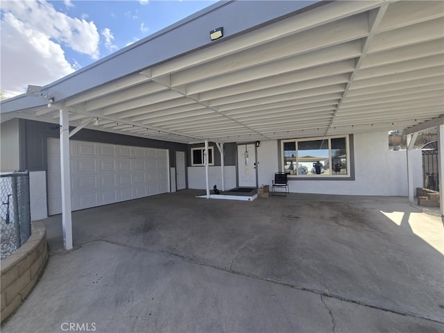 1212 Gen Ct, Barstow, CA 92311 - view of parking / parking lot featuring a carport and a garage