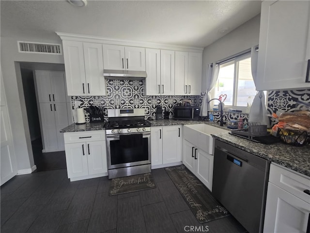 1212 Gen Ct, Barstow, CA 92311 - kitchen featuring appliances with stainless steel finishes, backsplash, under cabinet range hood, and white cabinets