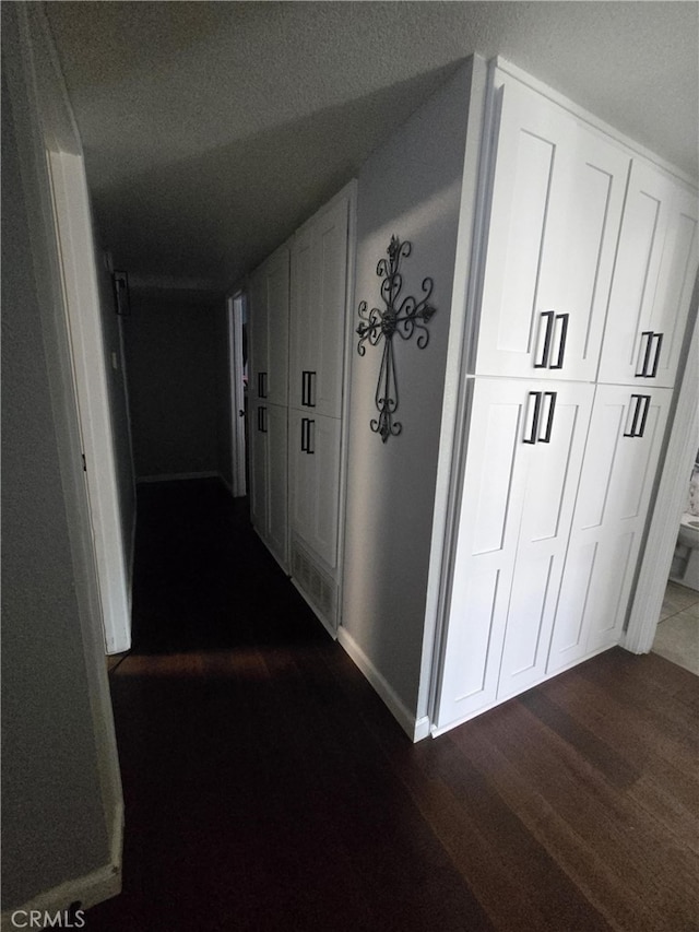 1212 Gen Ct, Barstow, CA 92311 - hall with dark wood-type flooring and baseboards