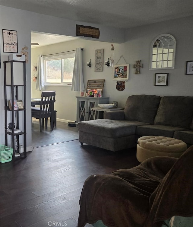 1212 Gen Ct, Barstow, CA 92311 - living area featuring dark wood-style floors and baseboards