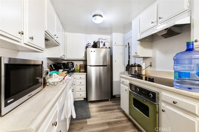 121 E Live Oak St, San Gabriel, CA 91776 - kitchen featuring stainless steel appliances, light wood-style floors, white cabinets, and light countertops