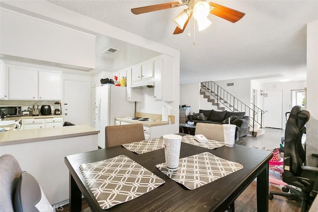 121 E Live Oak St, San Gabriel, CA 91776 - dining space with stairway, a ceiling fan, and wood finished floors