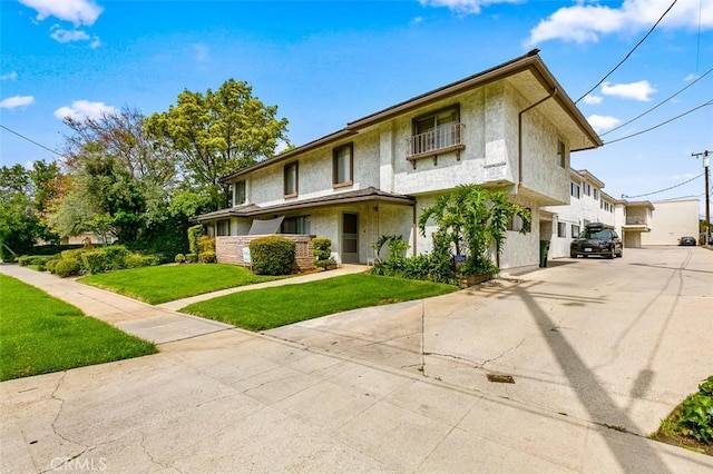 121 E Live Oak St, San Gabriel, CA 91776 - view of front of home with a front yard and stucco siding